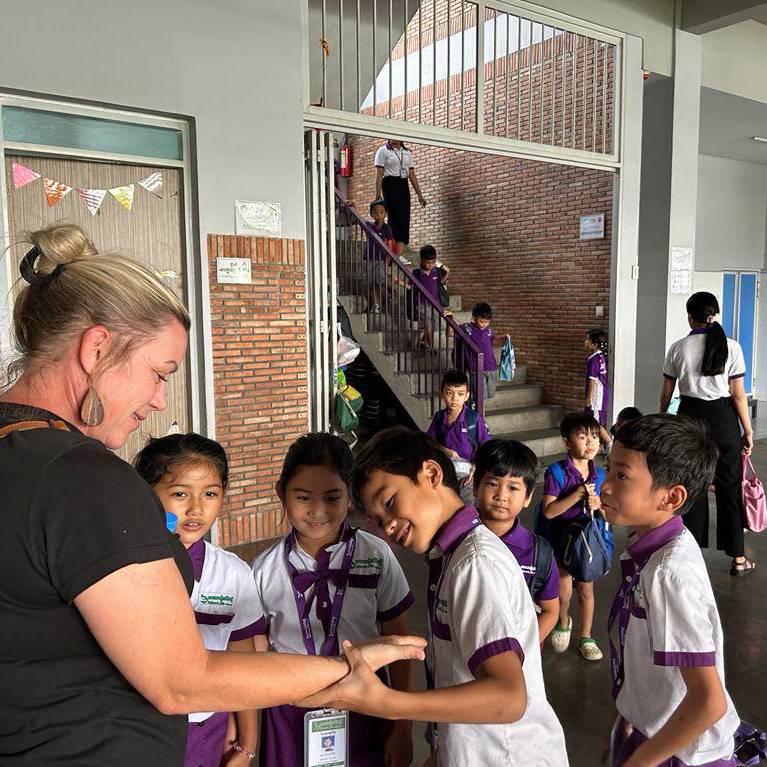 Image of Karissa with Kids from the Education Sponsorship Program