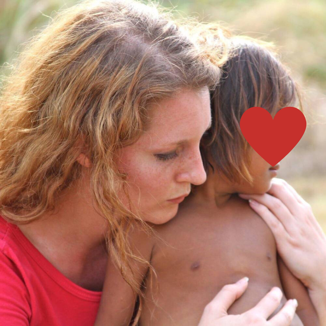 Andrea Comforting a Child